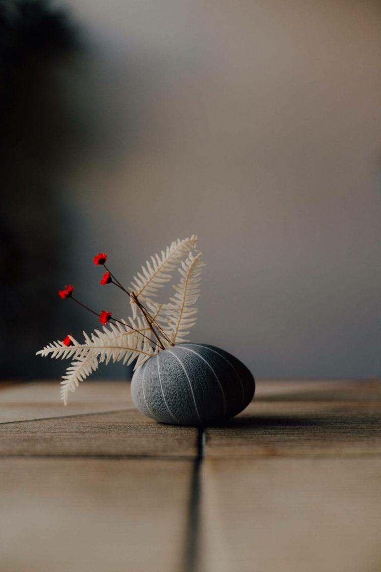 small bud vase with dried flowers