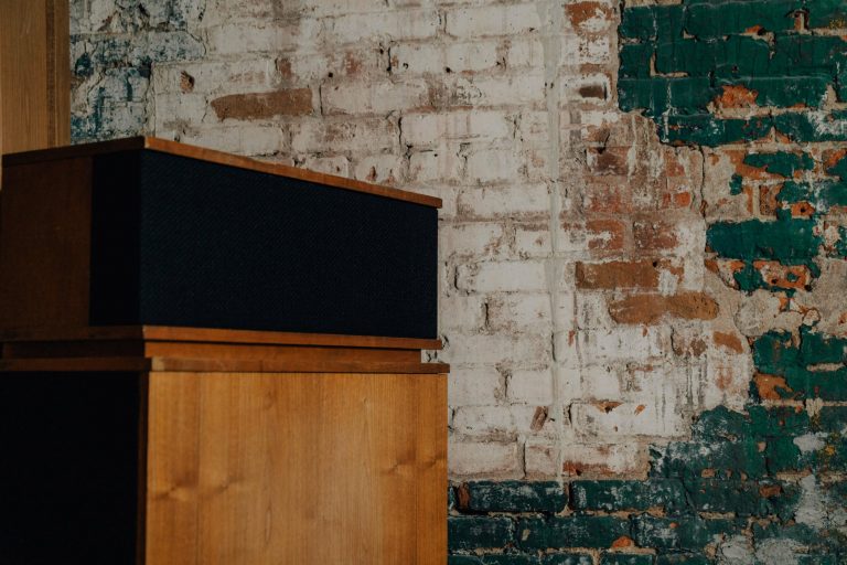 klipschorn against brick wall