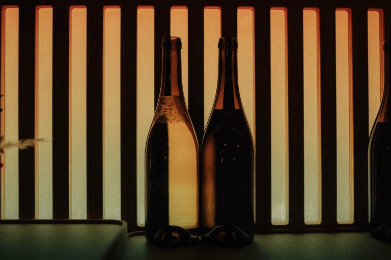 glass bottles in front of screen